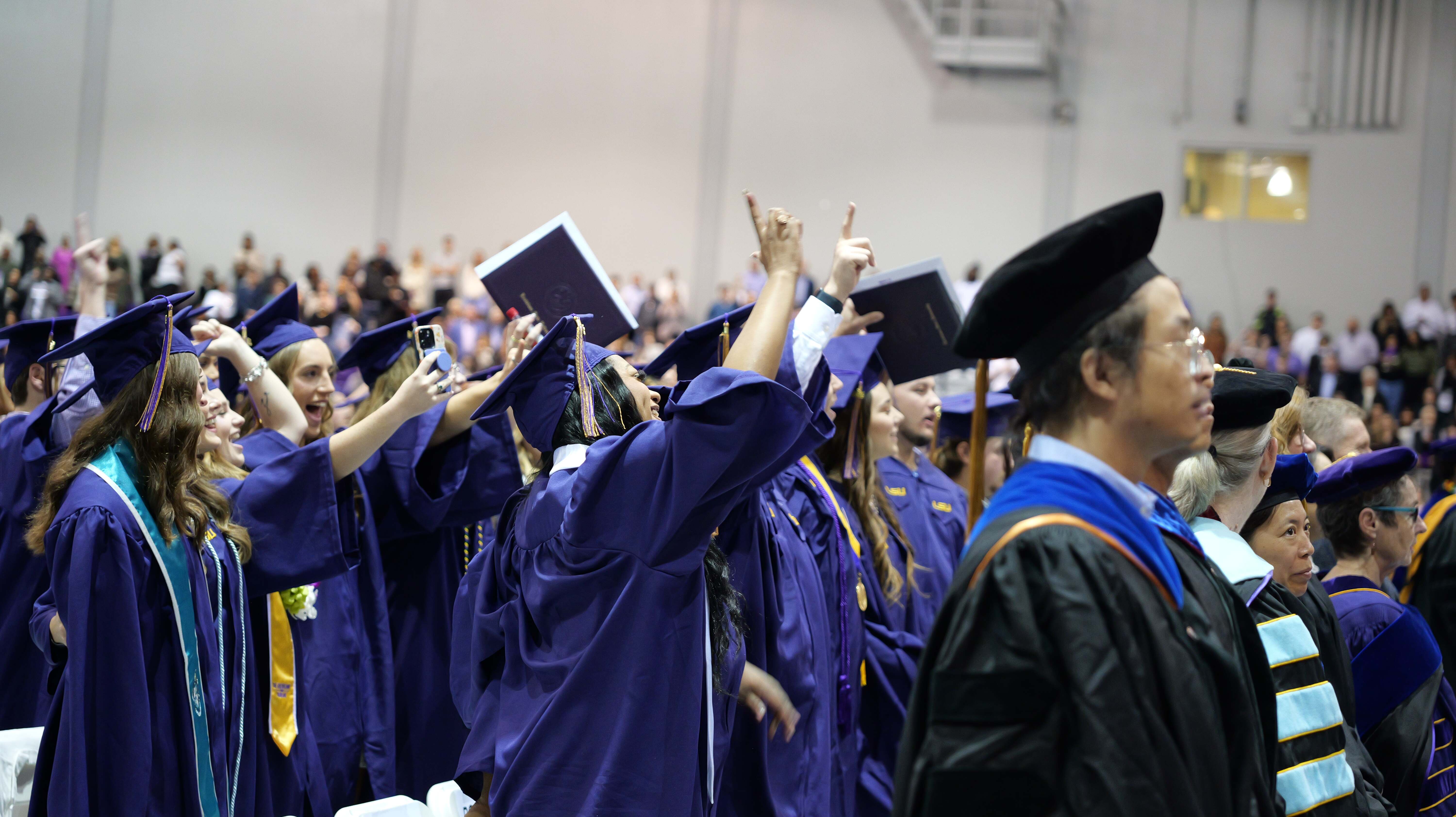 Graduates singing Alma Mater