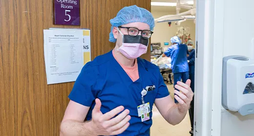 Dr. Jamie Tomes entering surgery room