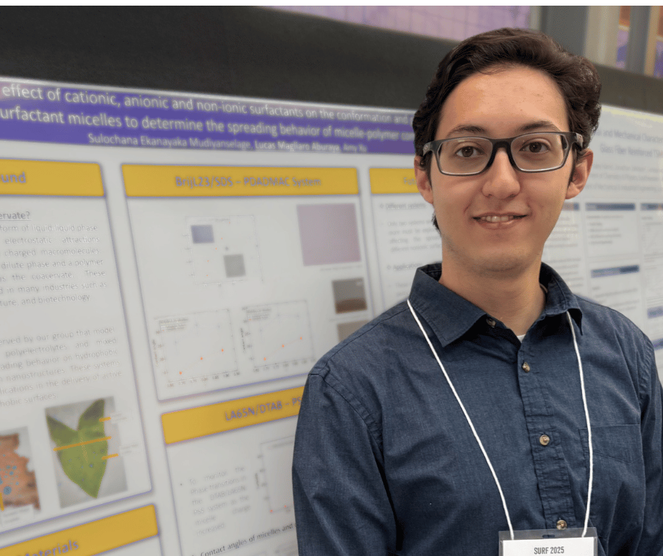 Lucas in front of his poster