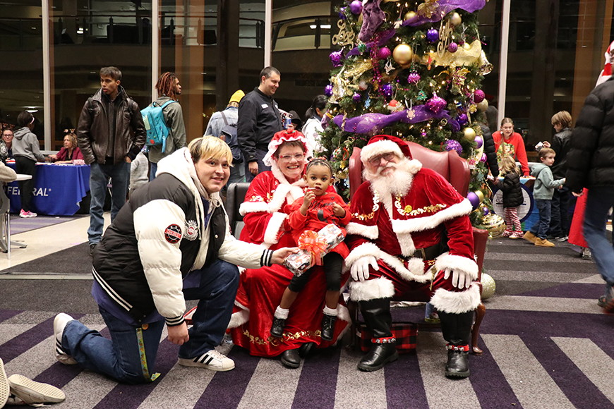 family with Santa and Mrs. Claus