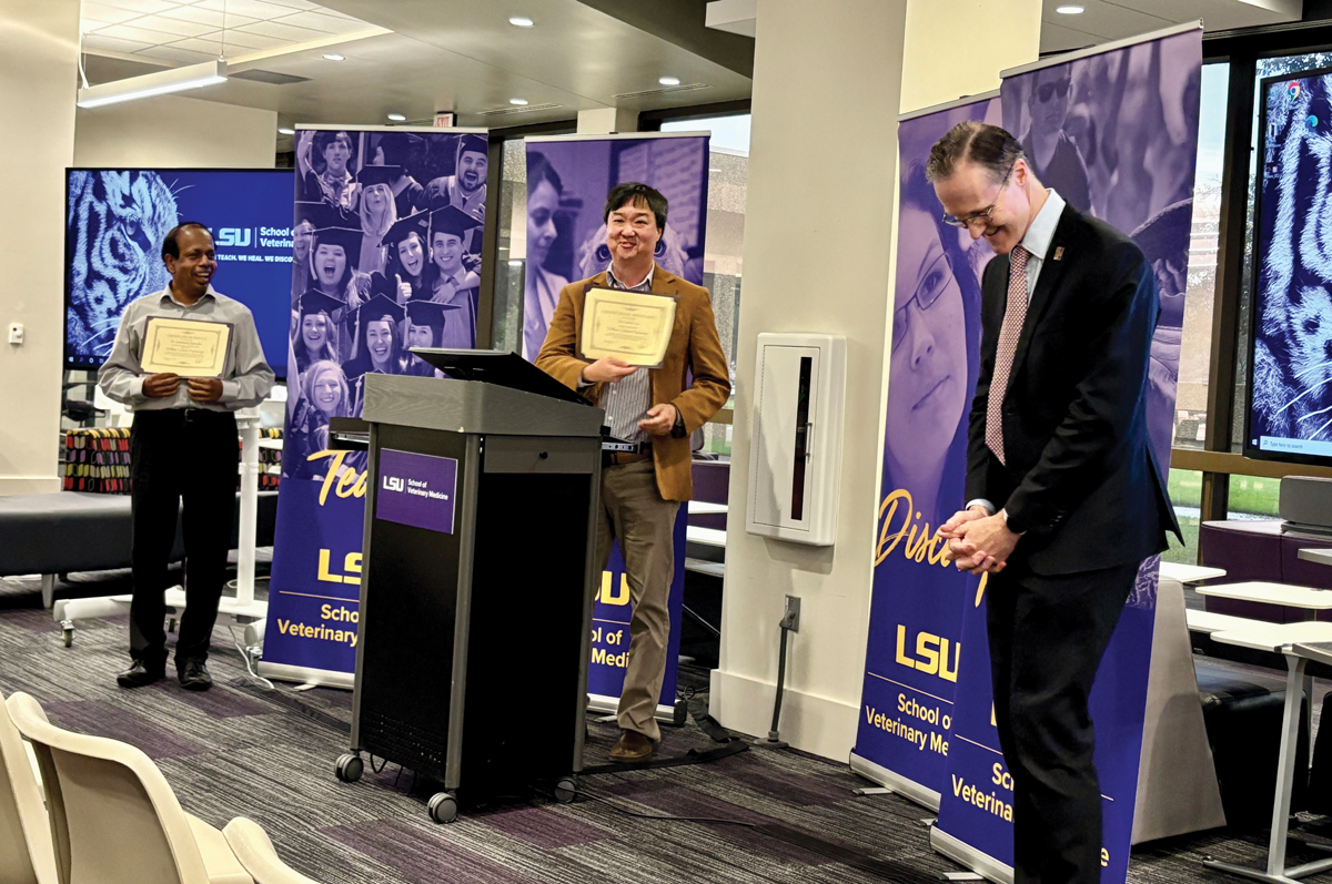 Dr. Charles Lee with his professorship certificate